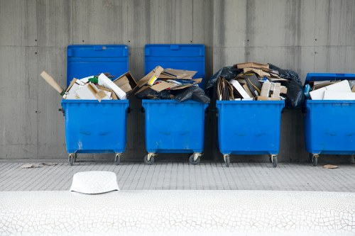 Operative preparing to lift commercial waste from a business property