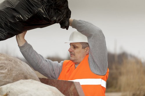 Operatives sorting recyclable commercial waste at a collection point